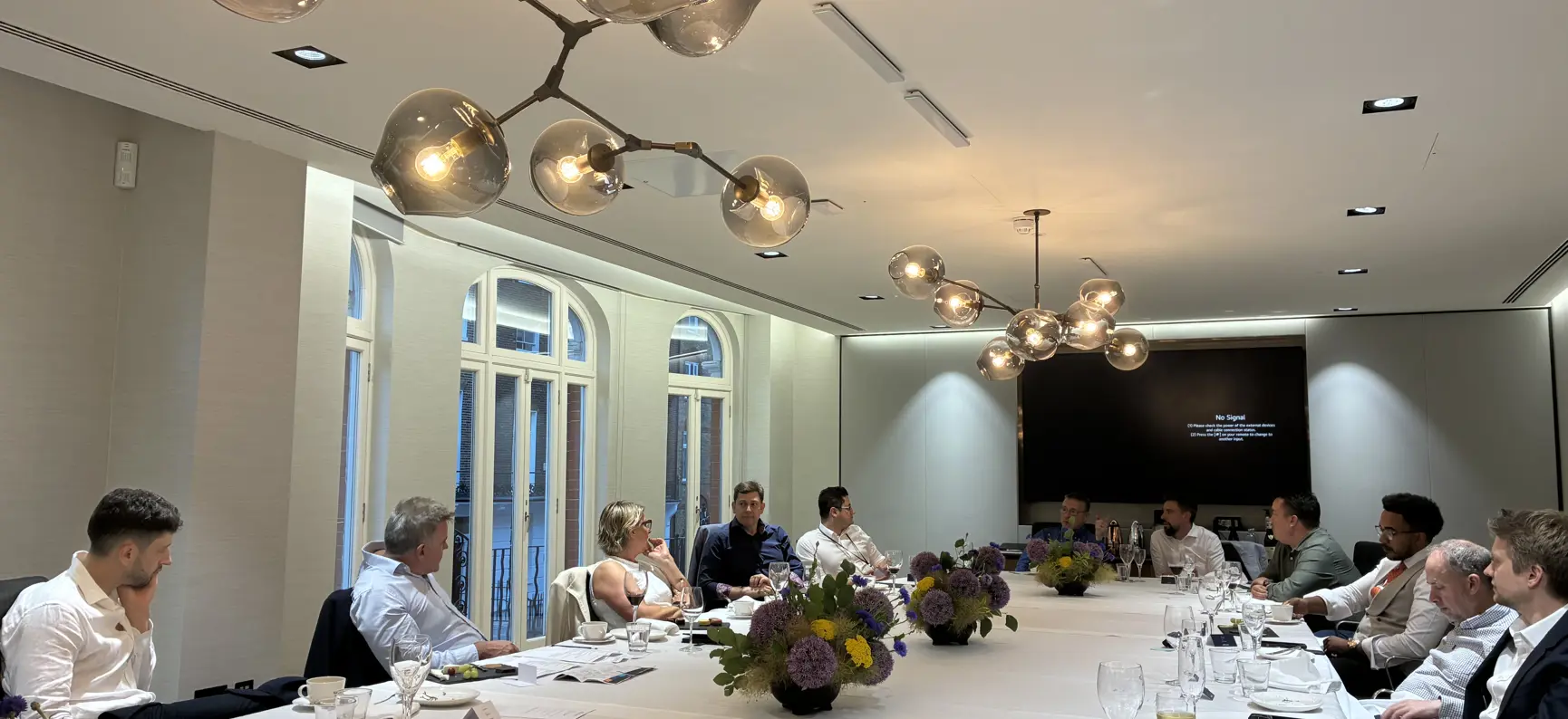 Attendees seated around a dining table at the Inflexion CIO dinner, London