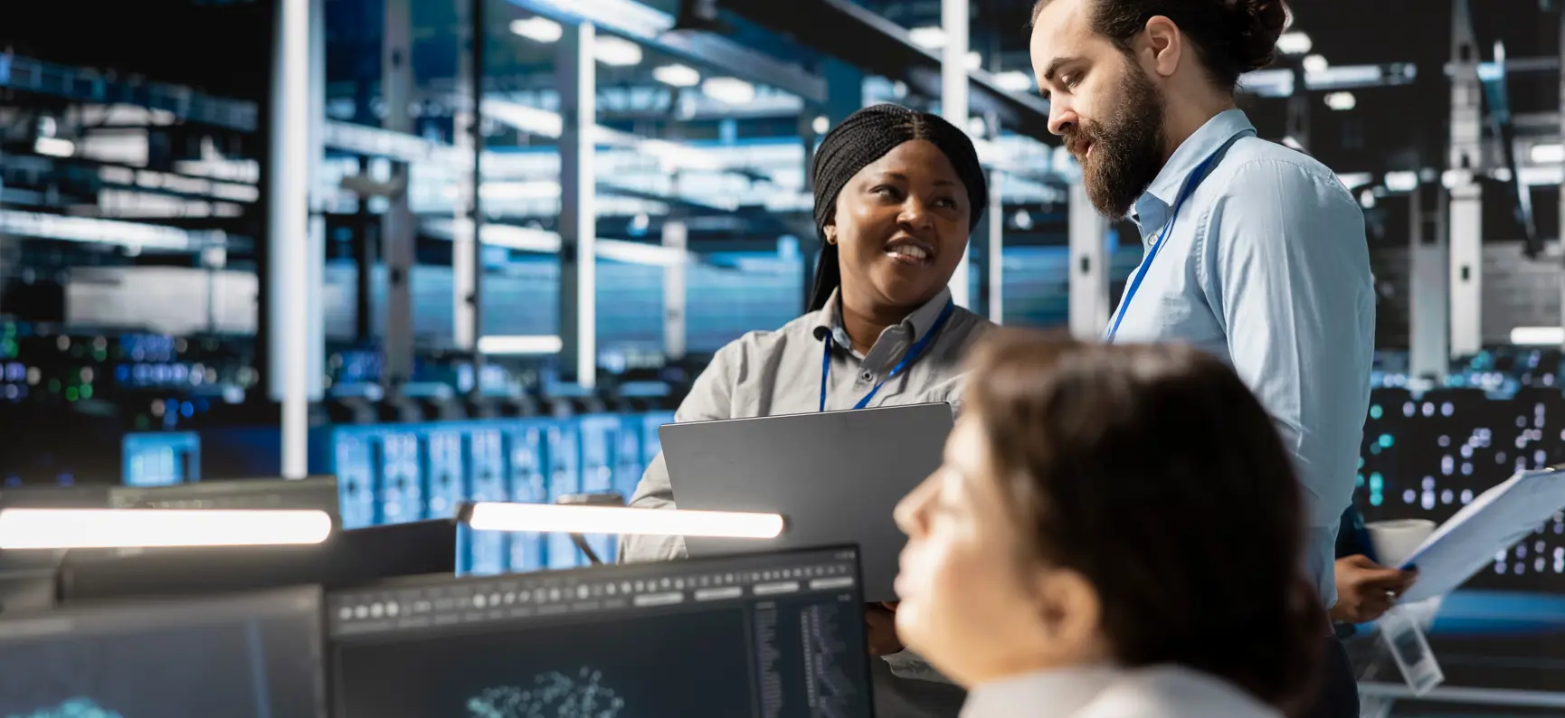 Team of engineers in data center integrating AI driven automation tools